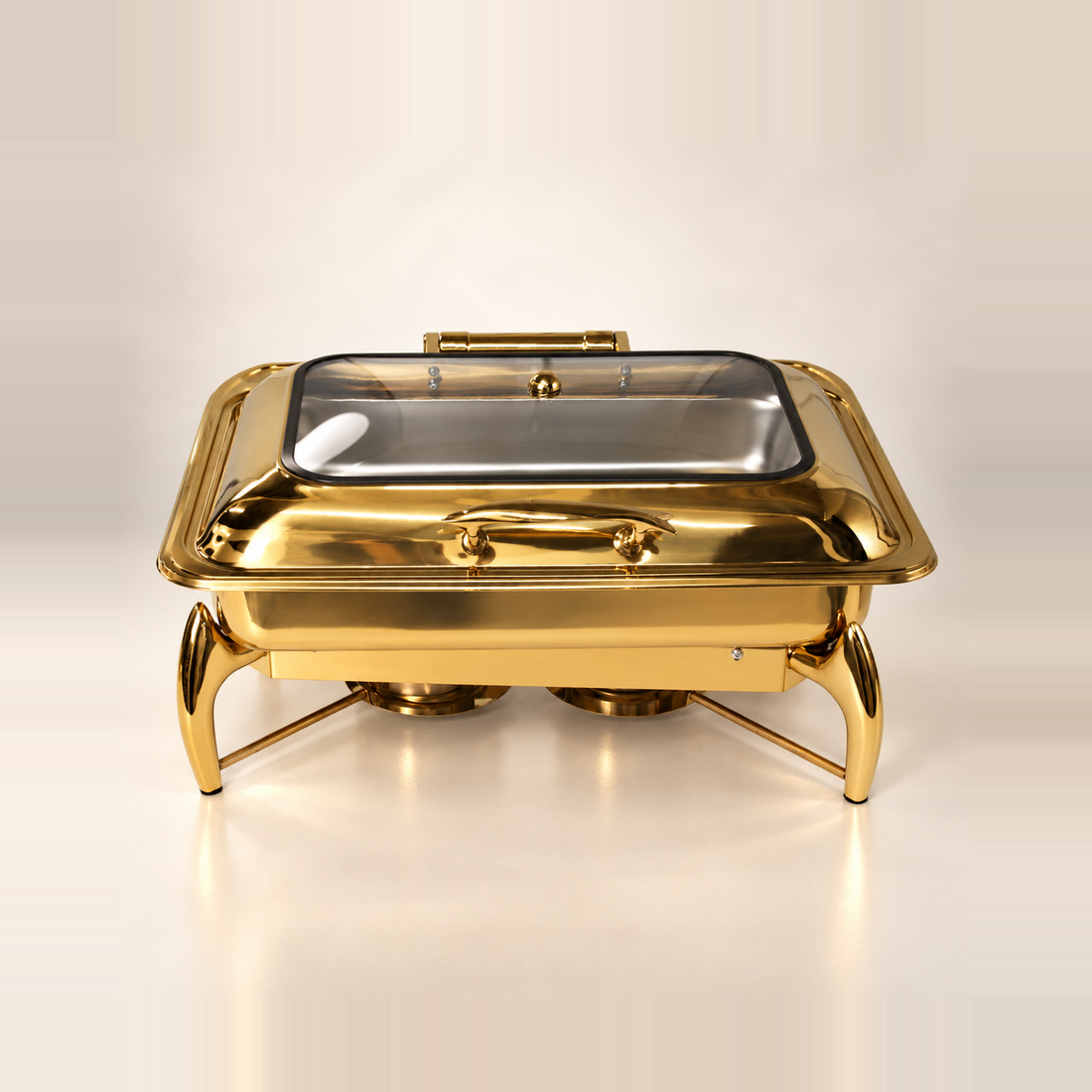 Gold Luxury Dining rectangle chafing dish, 9 litre, with a glass lid and curved gold legs, on a warm off-white studio background