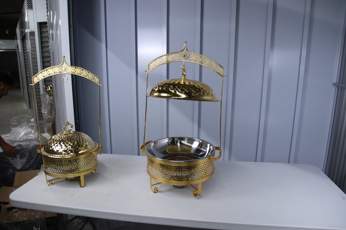 Gold hammered-dome hanging chafing dishes, small and large, with serving utensils