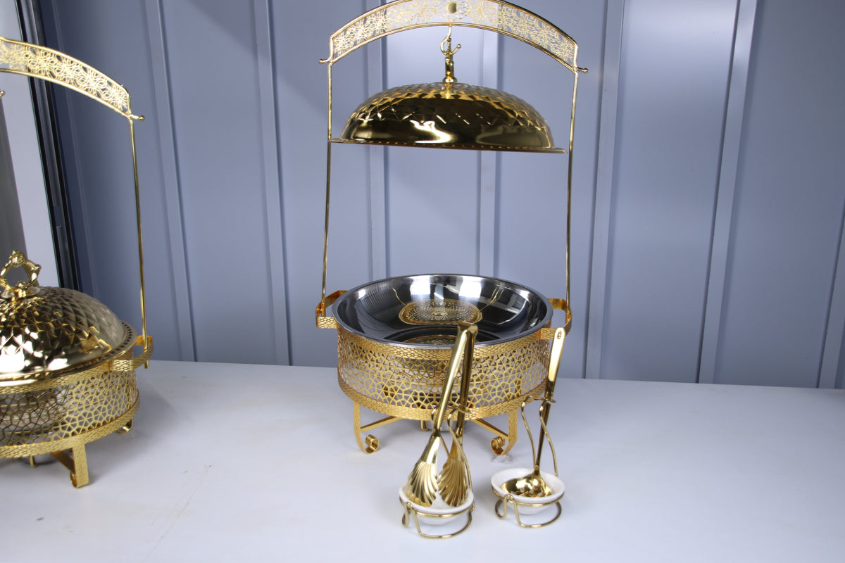 Gold Luxury Dining hanging chafing dish with a serving spoon and tongs in holders