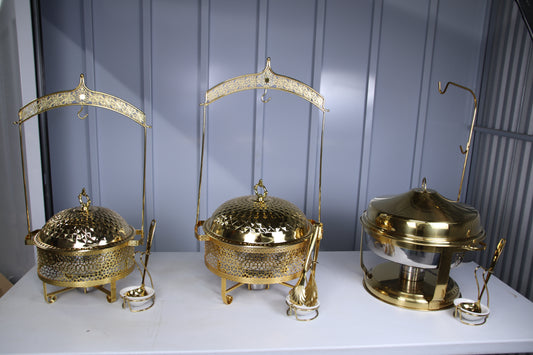 Two gold hammered-dome hanging chafing dishes in the 4.5 litre and 8 litre sizes beside a gold Deluxe Hanging dish