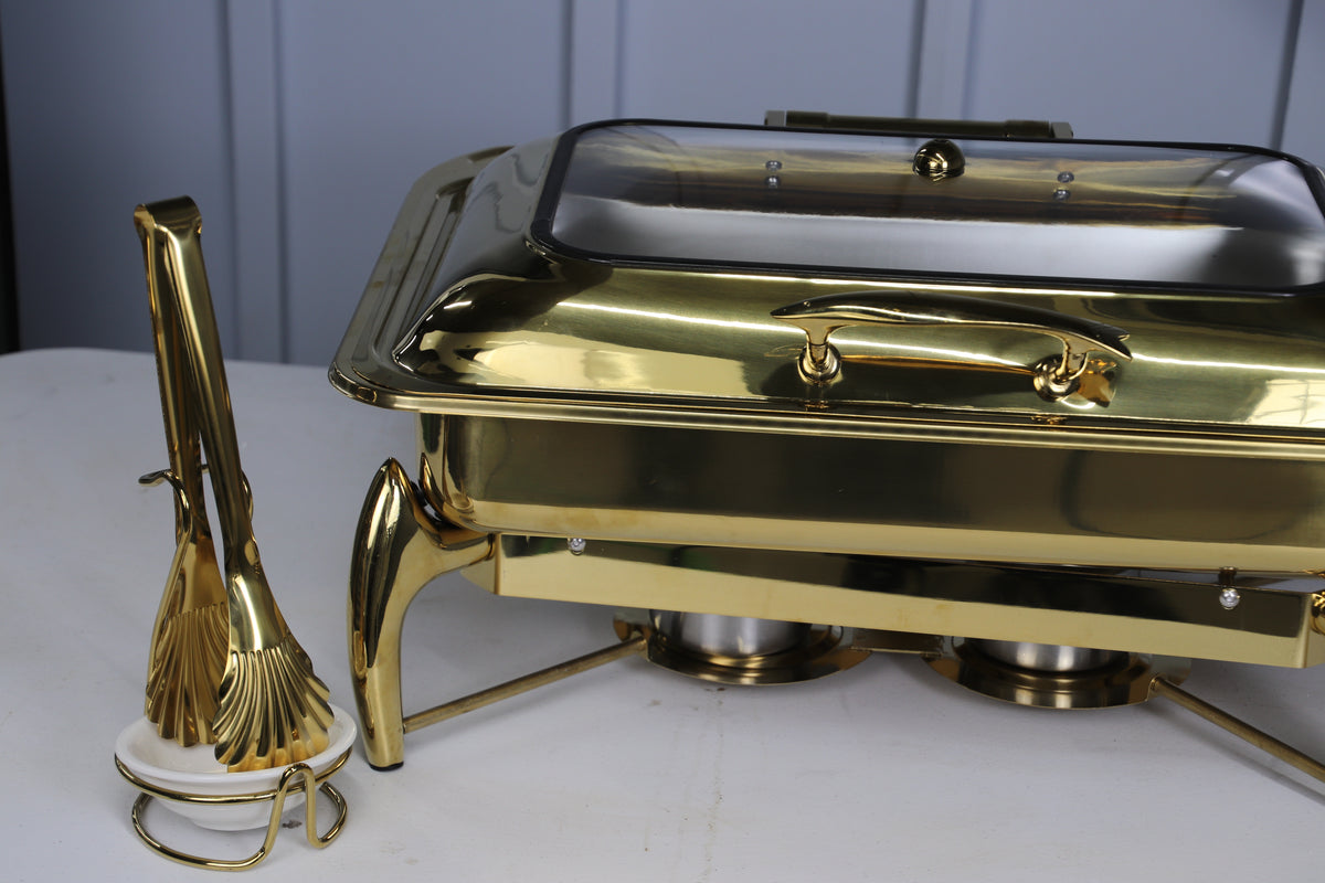 Gold Luxury Dining rectangle chafing dish with serving tongs beside it