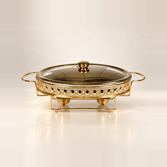 Crystal Clear home chafing dish, 3 litre, with a clear glass dish, gold frame and glass lid, on a warm off-white studio background