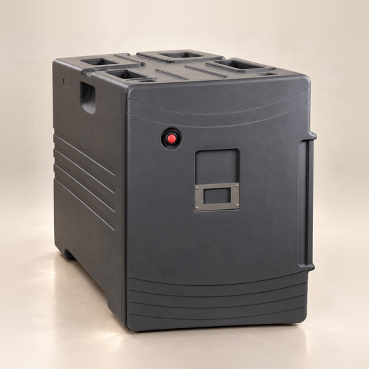 Dark charcoal insulated food pan carrier with the door closed, red push button and label plate on the door, on a warm off-white studio background