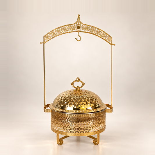 Gold Luxury Dining hanging chafing dish, 4.5 litre, with a patterned dome lid on an ornate hanging frame, on a warm off-white studio background