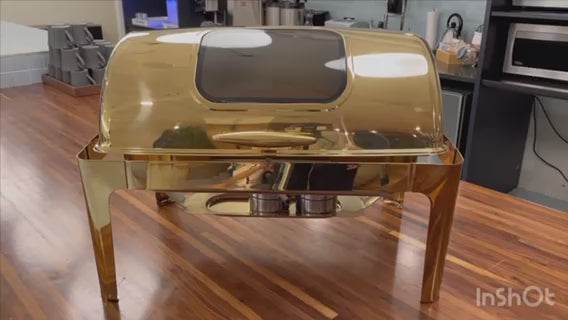 Video: gold Rolling Top rectangle chafing dish on a wooden counter